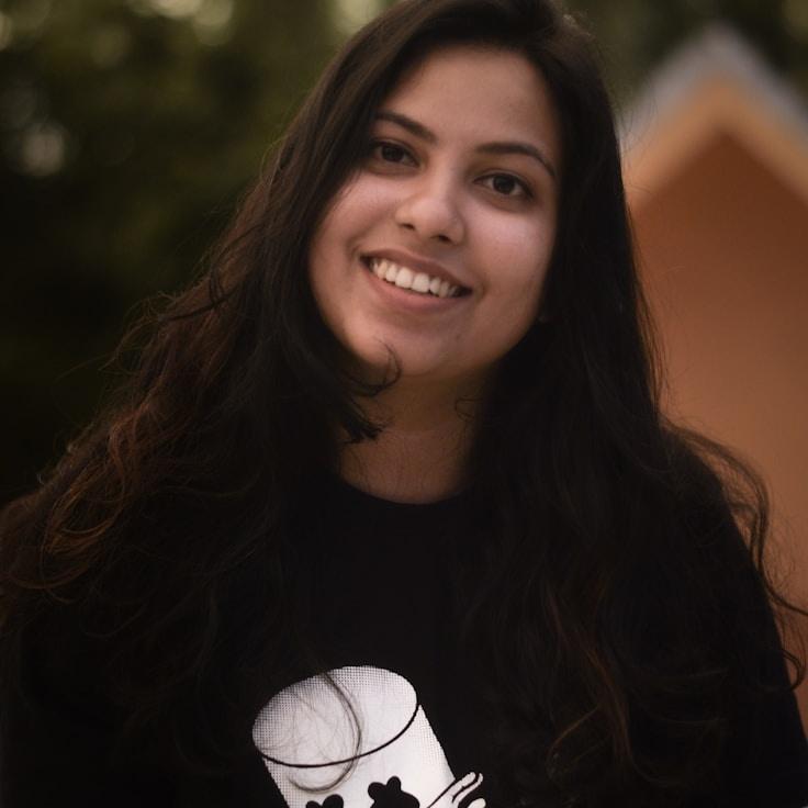 Avery Chen, Lead Design Curator at NeutralGrowthMatrix, reviewing corporate floral arrangements